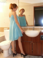 Teen blonde posing naked in the bathroom