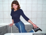 Russian teen undressing and posing in the kitchen