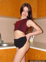 Russian teen brunette with small tits shows shaved pussy