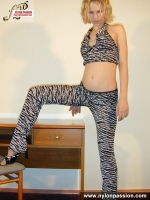Teen blonde plays with pantyhose