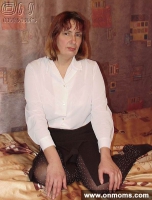 Mature blonde undresses and poses