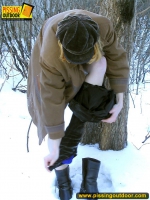 Teen blonde pisses on a winter tree