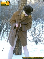 Teen blonde pisses on a winter tree