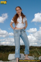 Teeb blonde pisses outdoor on rocks