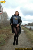 Outdoor pissing in leather jacket