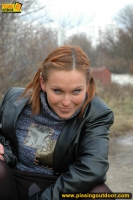 Outdoor pissing in leather jacket
