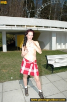 Teen brunette pissing in the park