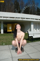 Teen brunette pissing in the park