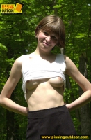 Pissing outdoor in the forest of naked teen girl