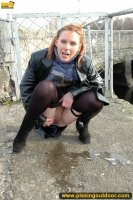 Teen blonde pissing outdoor in the city pond