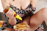 Pretty Aussie girl spills honey onto her body