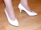 Slutty secretary in tights and white stilettos