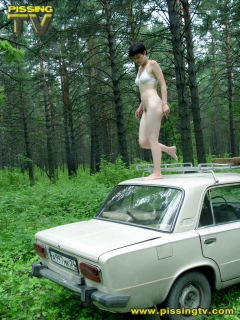 Brunette pissing in a forest - N