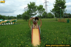 Outdoor pissing on a park slide - N
