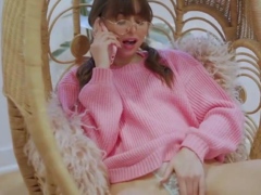 Brunette female in pink sweater likes a phone kink