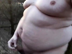 Chubby masturbates in the woods