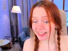 redhead-busty-teen-with-glasses-masturbating