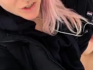 Outdoor solo masturbation scene with curly blonde