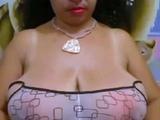 Big-Breasted Black Mature Woman Shows Off on Webcam